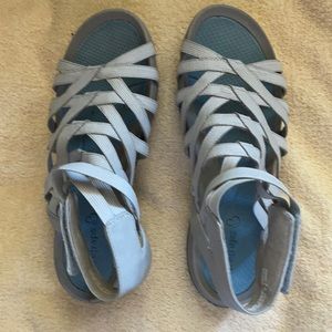 Soft and so comfortable strappy sandals. They are light blue.